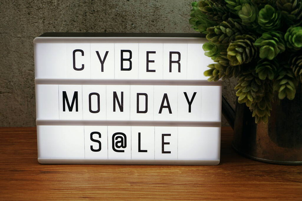 Cyber Monday Sale word in light box on wooden background - Zdjęcie, obraz