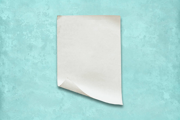 old paper on wall, mint blue background - Photo, Image