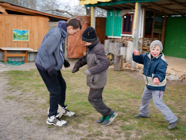 village children play soccer with ball on nature 2020 - Foto, Imagem