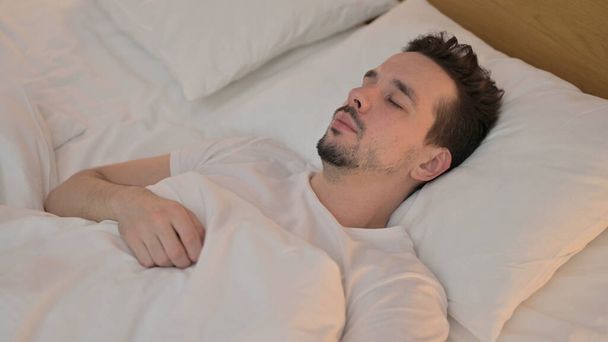 Handsome Young Man Sleeping in Bed - Foto, imagen