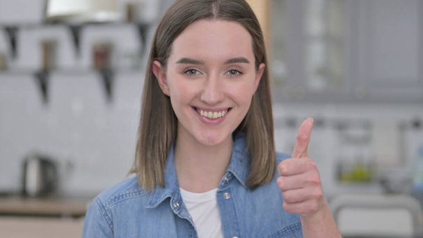 Portrait of Beautiful Young Woman showing Thumbs Up - Fotografie, Obrázek