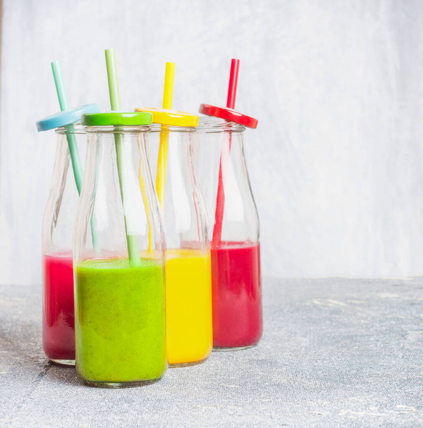 Grooup of bottles with colorful drinks: smoothies or juices  - Foto, immagini