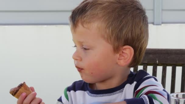 Portrait of toddler eating chocolate ice cream - Footage, Video