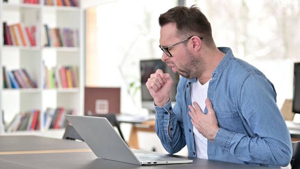 Coughing Sick Young Man in Glasses at Work, Throat Sore - Photo, Image