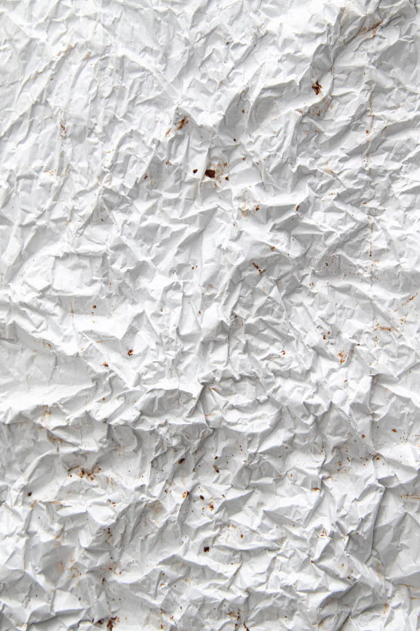 The background texture is made of crumpled white paper. - Photo, Image