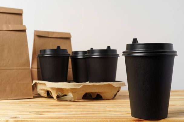 Paper bags with take away food and coffee cups containers - Foto, imagen