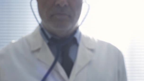 Doctor examining a patient, point of view shot - Felvétel, videó