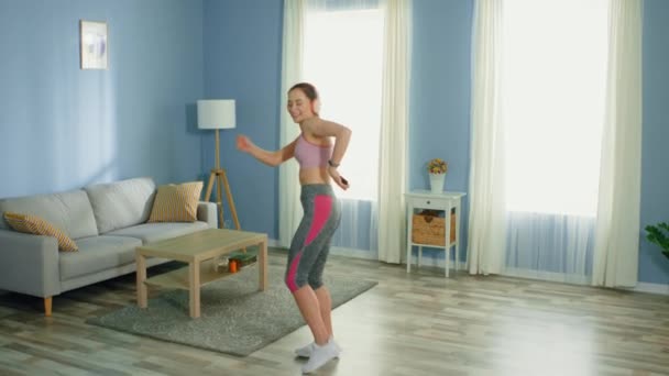 Young Joyful Woman Is Dancing in Living Room - Imágenes, Vídeo