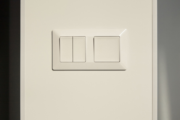 modern switch on white wall in apartment  - Fotoğraf, Görsel