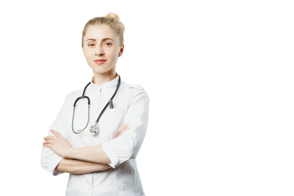 Attractive woman doctor in medical coat and stethoscope with copy-space on isolated background. Healthcare Medicine People Concept - Foto, imagen