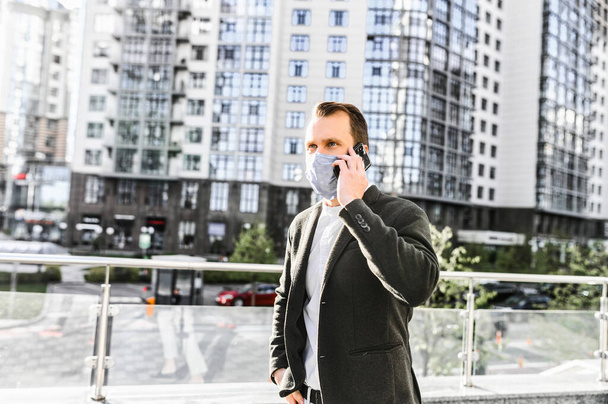 Man in smart casual wear with a protective mask - Zdjęcie, obraz
