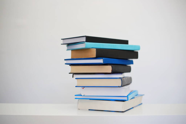 Stack of books on white background - Foto, afbeelding
