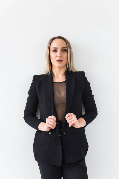 Fashion concept - Portrait of sexy business woman in a suit on white background. - Fotografie, Obrázek