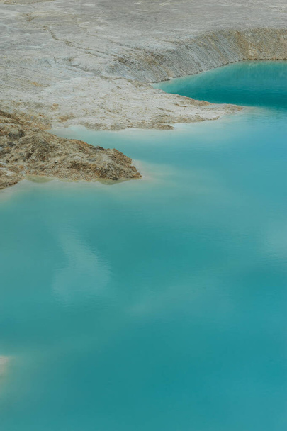 turquoise water and white shore in a kaolin quarry - Photo, Image