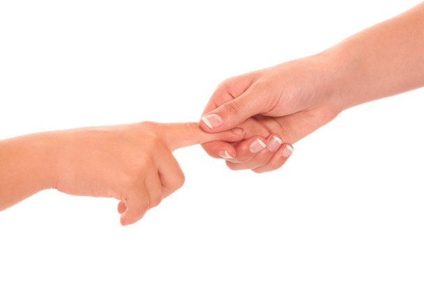 fiatal, nő és gyermek lány kézfogás elszigetelt fehér background. - Fotó, kép