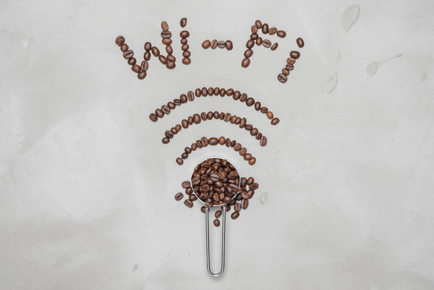 symbol Wi-Fi lined with coffee beans on a white background, coffee beans forms a wifi symbol - 写真・画像