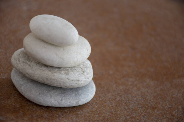 Four stones with brown backgorund - Фото, зображення