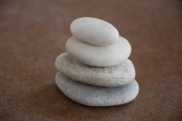 Four stones with brown backgorund - 写真・画像