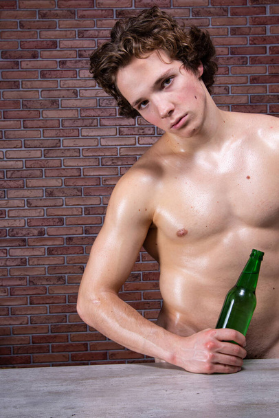Young handsome guy is drinking - Foto, afbeelding