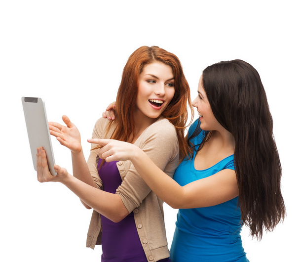 Two smiling teenages with tablet pc computer - Foto, Imagem