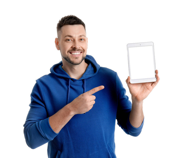 Handsome man with tablet computer on white background - Φωτογραφία, εικόνα