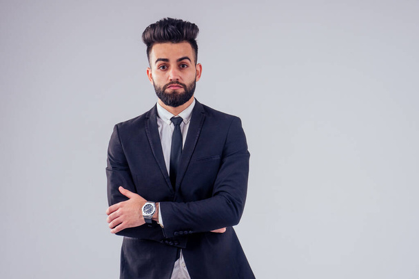 young handsome black hair man in stylish business suit in studio isolate white background - Valokuva, kuva