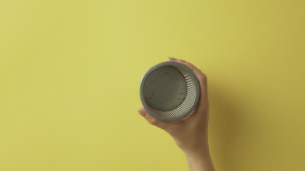 Woman puts Color pencils to cup - Video