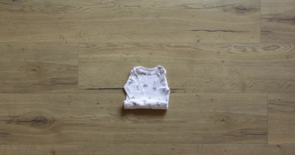 Seasonal baby girl clothes stop motion animation. Warm Outfit for winter - Footage, Video