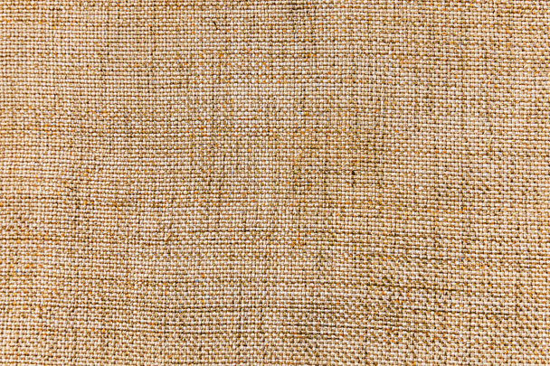 De textuur van linnen stof voor de achtergrond. Canvas grove textuur. Bruine jute textuur - Foto, afbeelding