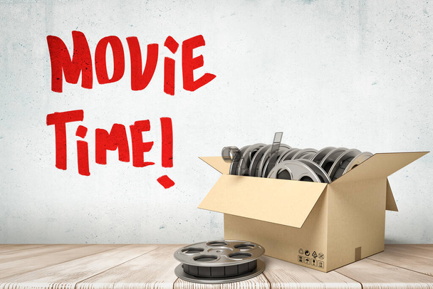 3d rendering of cardboard box full of film reels standing near grungy wall with title Movie Time. - Foto, afbeelding