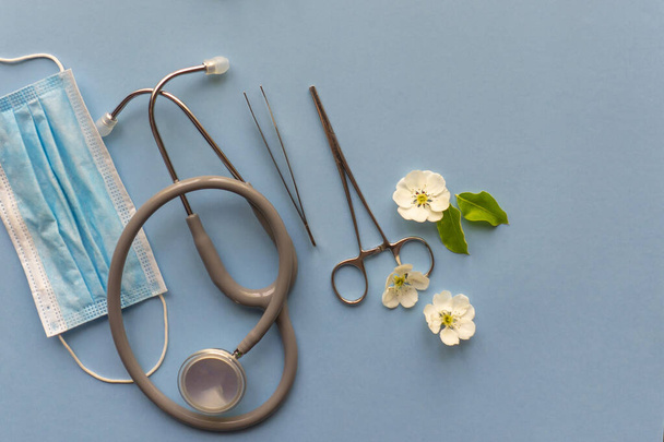 collage of medical instruments on a blue background as a symbol of health care - Photo, Image