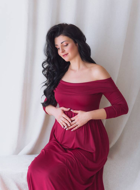 Beautiful Pregnant Woman Posing in Studio - Fotó, kép