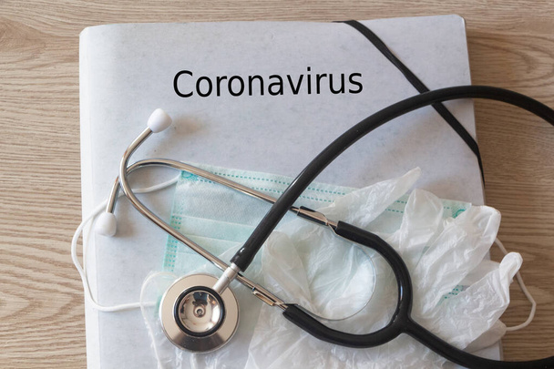 File, coronavirus, medical mask, latex gloves and stethoscope - Foto, Bild