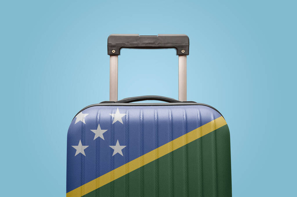 Suitcase with Solomon Islands flag design travel Oceania concept. - Foto, afbeelding