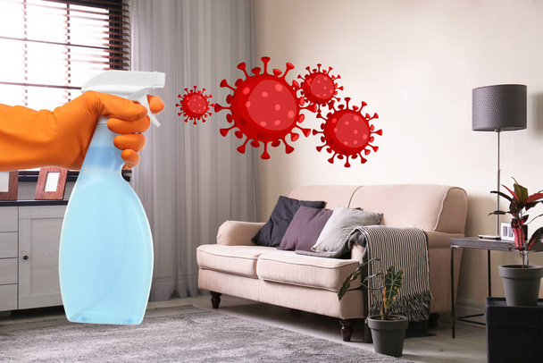 Keep your home virus-free. Woman cleaning room with disinfecting solution  - Foto, Imagen