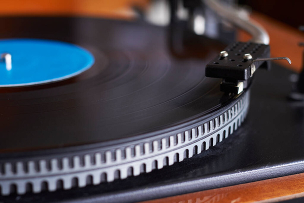Extreme closeup of blue music record on turntable, turntable needle playing music, selective focus - Photo, Image