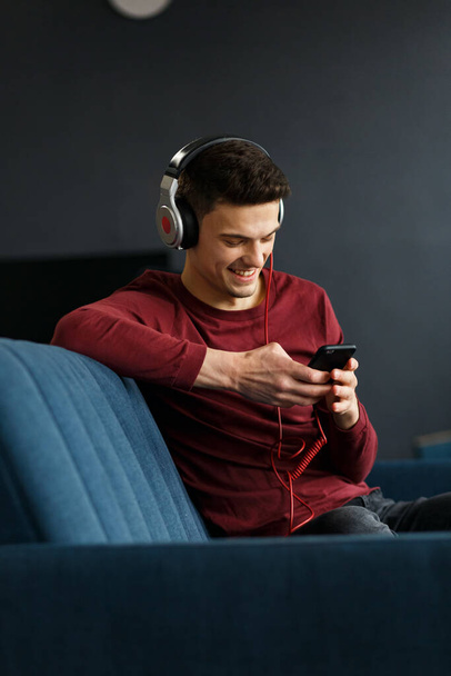 Enjoy listening to music.Young man in headphones listening music - Photo, Image