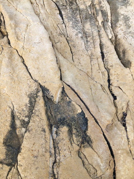 yellow grunge rock texture background with cracks.yellow mountain texture closeup. Cracked natural stone surface - Fotó, kép