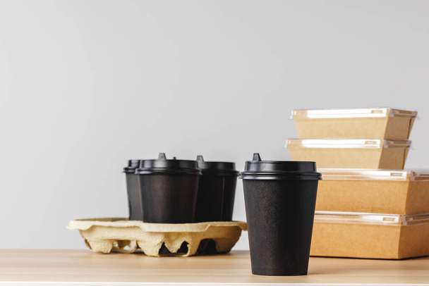 Many various take-out food containers, pizza box, coffee cups and paper bags on light grey background - Foto, afbeelding