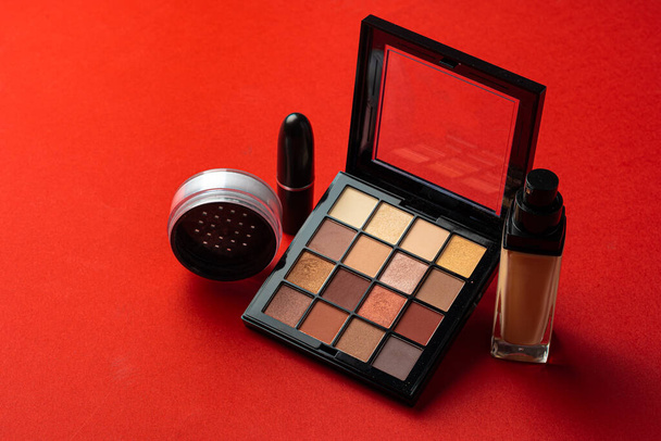 Set of cosmetics isolated over red background. - Foto, Imagen