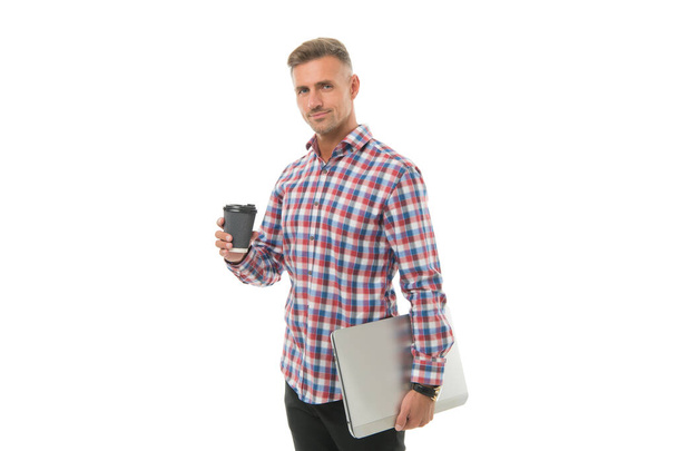 On my way to success. Handsome man enjoying coffee to go. Happy hipster holding laptop and coffee cup white background. Coffee wakes me up in morning. Regular office worker concept. Work from home - Fotografie, Obrázek