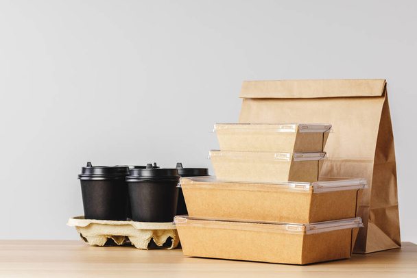 Many various take-out food containers, pizza box, coffee cups and paper bags on light grey background - 写真・画像