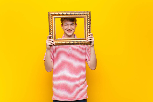 young blonde man with a baroque frame - Foto, afbeelding