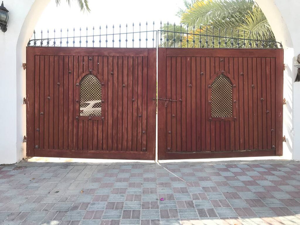 Wooden shutter with Steel Framed Gate for an Big Villa or palace and two holes for identification of personnel - Photo, Image