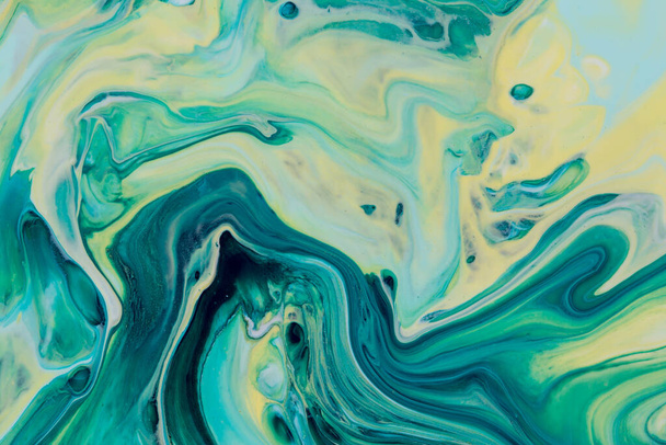 Abstract background of acrylic paint in yellow and aquamarine tones - Фото, изображение