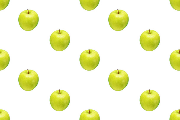 Pattern of green apples on a white background. Isolated fruits. Image for fabric, wallpaper and wrapping paper - Photo, image