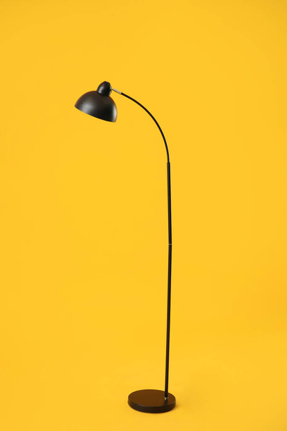 Stylish lamp on color background - Foto, afbeelding