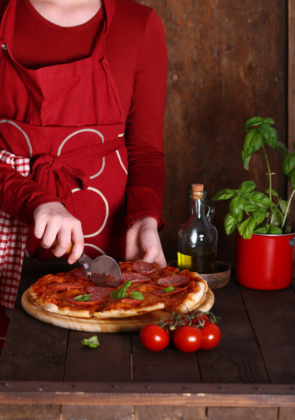 homemade pepperoni pizza on a wooden table - Фото, зображення