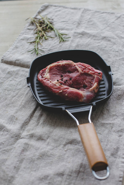 Food. Raw steak on a pan - 写真・画像