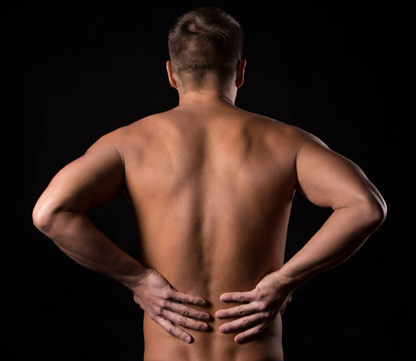Guy has pain in the back - Foto, Bild